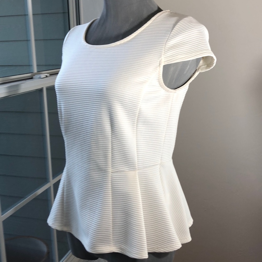 Striking Architectural Peplum Top